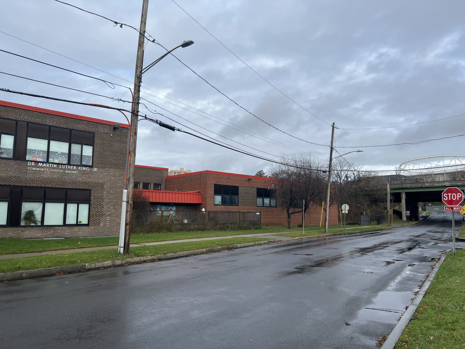 The exterior of an elementary school with I-81 closeby in the background.